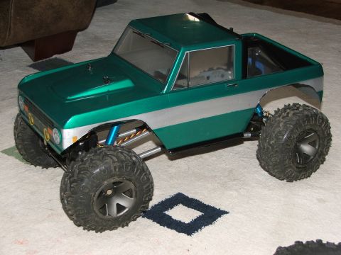 1996 Ford Bronco - This RC rock crawler model has a green and silver body with oversized tires.