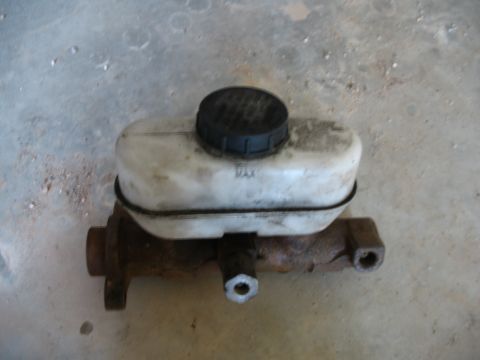 1989 Ford Bronco - A brake master cylinder is shown, with a visible 'MAX' marking on its reservoir.