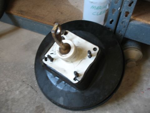 1989 Ford Bronco - A brake booster assembly is shown, likely for a vehicle's braking system.