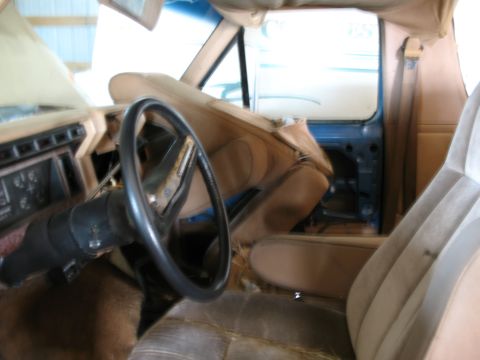 1989 Ford Bronco - Interior view of a 1989 Ford Bronco, highlighting the dashboard and seating areas.