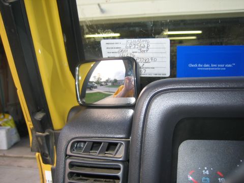 2001 Jeep Wrangler - Interior view of a 2001 Jeep Wrangler, confirmed by a visible registration sticker and the vehicle's make and model year.