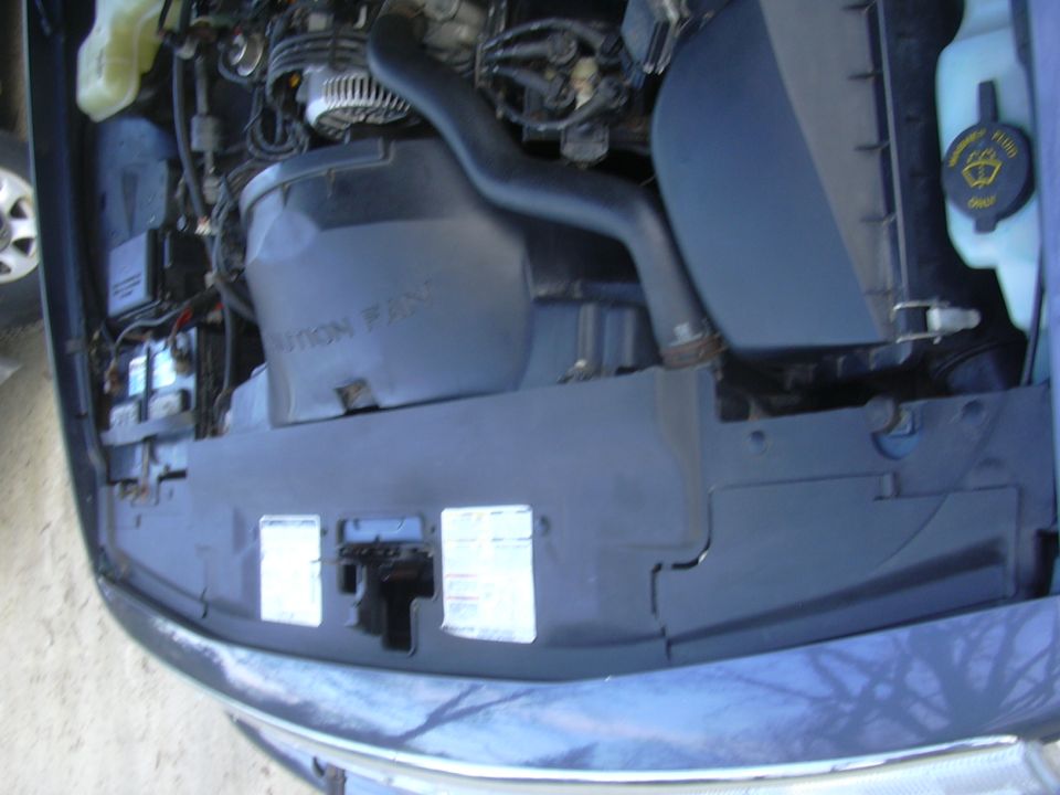 engine bay with air intake and battery