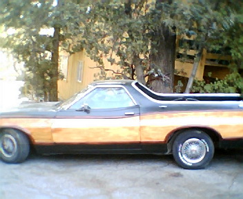 1973 Ford Ranchero - This 1972 Ford Ranchero pickup truck is seen from the side, a two-tone paint scheme and woodgrain trim.