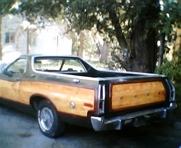1973 Ford Ranchero - Rear view of a 1973 Ford Ranchero Squire its distinctive wood paneling and chrome bumper.