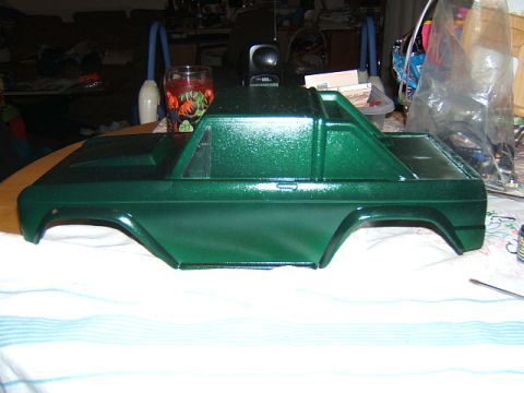 1988 Ford Bronco - This is a green metallic RC car body, viewed from the side, with visible fender flares and a distinct roofline.