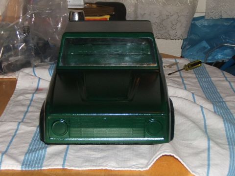 1988 Ford Bronco - A green toy truck body sits on a towel, with a screwdriver nearby.