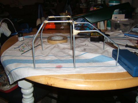 1988 Ford Bronco - A metal roll cage frame is shown on a table, suggesting a hobbyist project or model building.