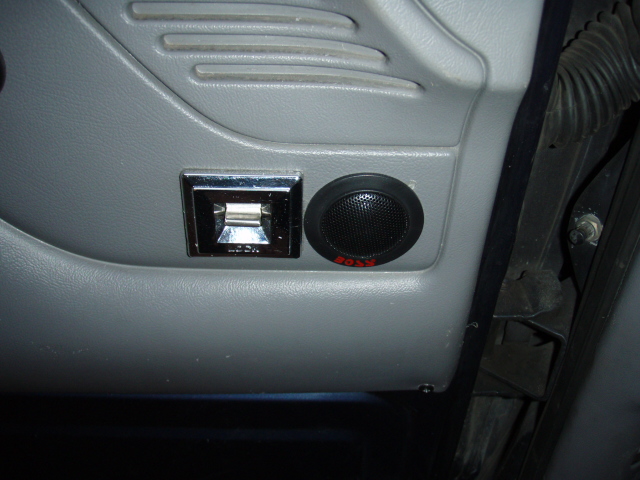 Door panel with switch and aftermarket tweeter speaker