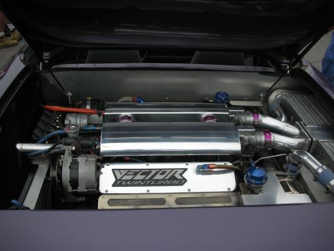 1998 Ford Crown Victoria - Engine bay of a Vector supercar showing a polished aluminum plenum labeled Vector Twin Turbo with blue fittings.