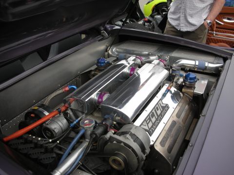 1998 Ford Crown Victoria - highly polished mid-engine bay labeled Vector Twin Turbo shows aluminum intake plenums, braided lines and intercooler piping.