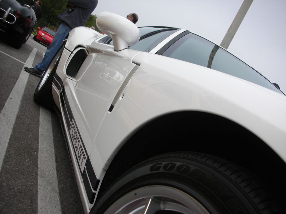Side profile detail of a white Ford GT showing door scoop and mirror