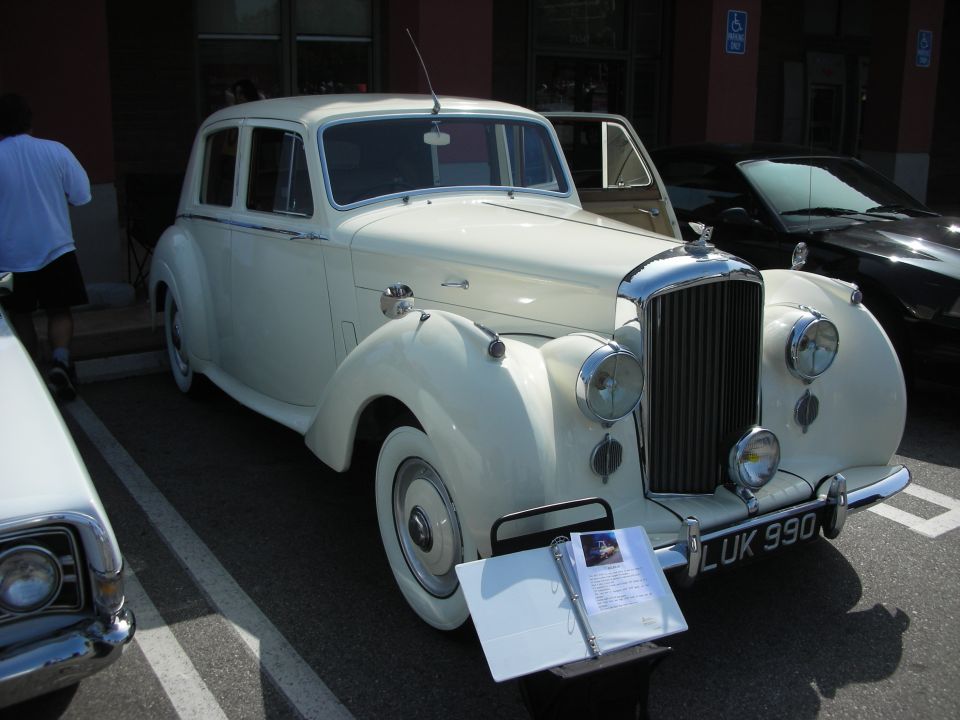 Cream Bentley sedan with chrome grille, UK plate LUK 990