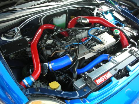 1998 Ford Crown Victoria - modified Subaru engine bay with red and blue intercooler piping, polished plenum and a Motul decal.