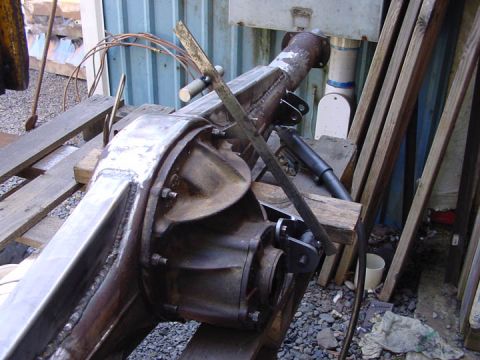 1979 Ford Bronco - Close-up view of a rear axle assembly newly welded traction bar mounts.