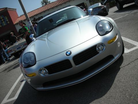 1998 Ford Crown Victoria - Low front view of a silver BMW roadster showing the twin-kidney grille, BMW roundel and twin headlight pods.