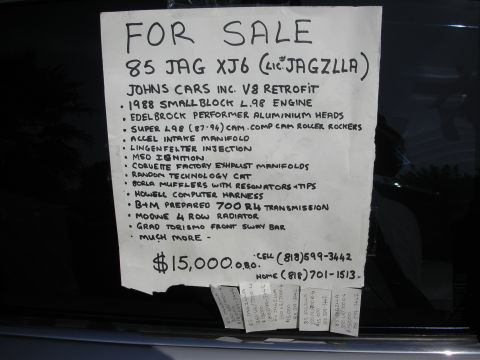 1998 Ford Crown Victoria - Handwritten FOR SALE sign for a 1985 Jaguar XJ6 V8 retrofit listing modifications, price and contact numbers.