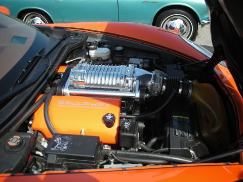 1998 Ford Crown Victoria - Engine bay of an orange Corvette fitted with a Callaway-branded supercharger and polished intercooler over the V8.