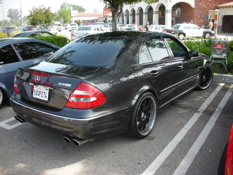 Rear of dark gray Mercedes-Benz E-class sedan with black wheels