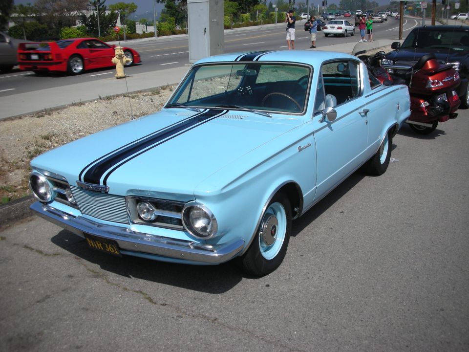 Light blue 1960s Plymouth Barracuda with black racing stripes