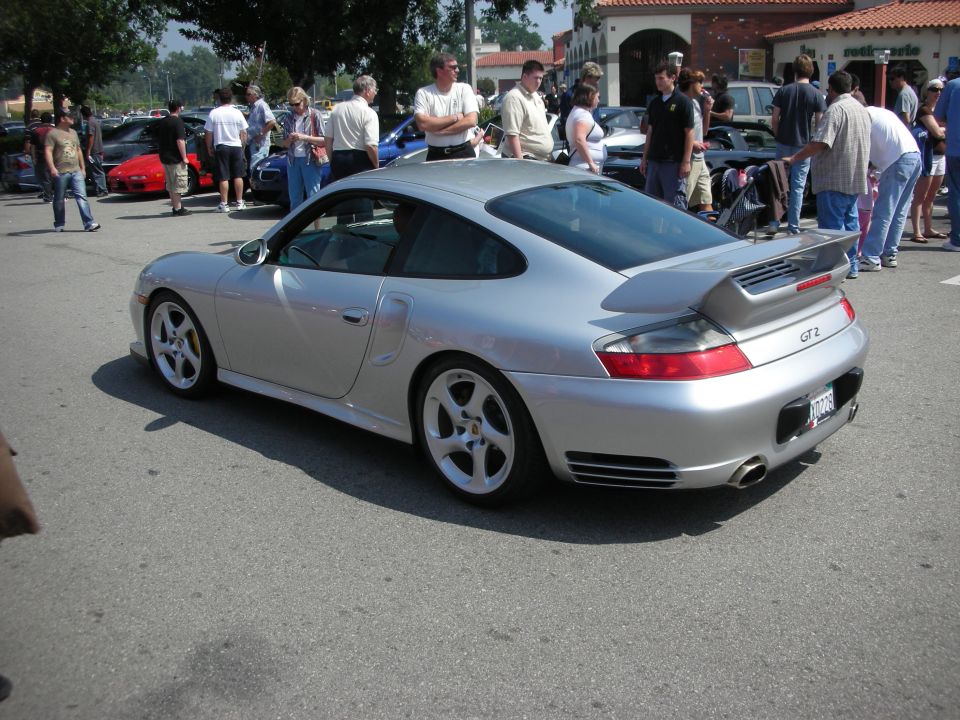 Silver Porsche 911 GT2 coupe rear three-quarter with fixed wing
