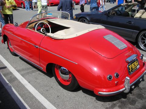 1998 Ford Crown Victoria - red Porsche 356-style Speedster with a tan tonneau cover and body-color steel wheels parked at a car show, plate '3P BS 964'.