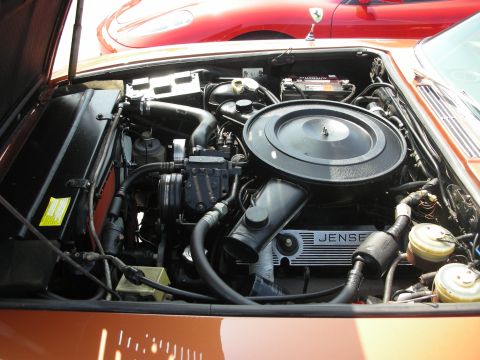 1998 Ford Crown Victoria - Jensen engine bay showing a large round black air cleaner and a finned valve cover marked Jensen.