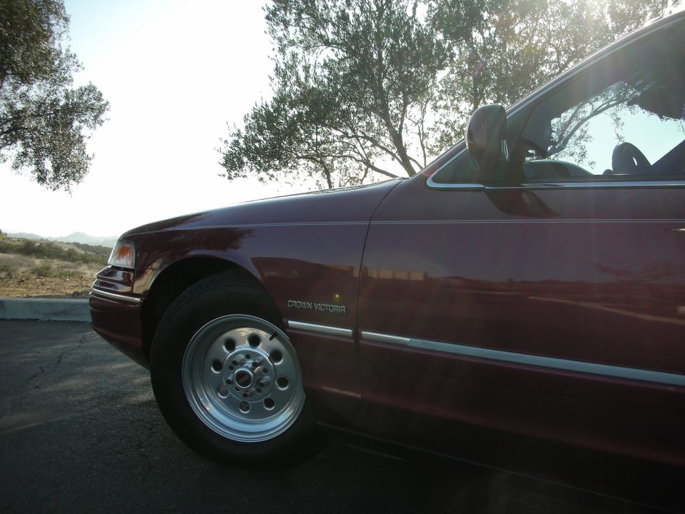 Maroon 1992 Ford Crown Victoria, 3/4 front view, showing lowered stance