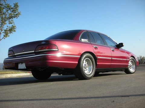 1992 Ford Crown Victoria - Rear view of a red 1992 Ford Crown Victoria modified with drag radial tires.
