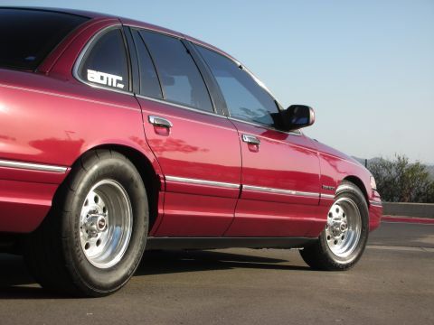 1992 Ford Crown Victoria - This 1992 Ford Crown Victoria is shown from the side, drag tires and a lowered stance.