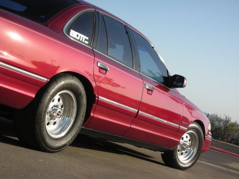 1992 Ford Crown Victoria - 1992 Ford Crown Victoria with custom wheels and drag tires on the rear.