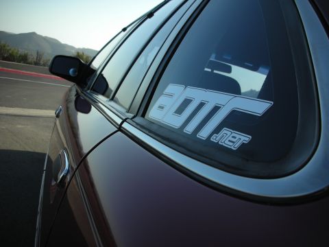 1992 Ford Crown Victoria - A close-up view of a car's rear window, a prominent sticker.
