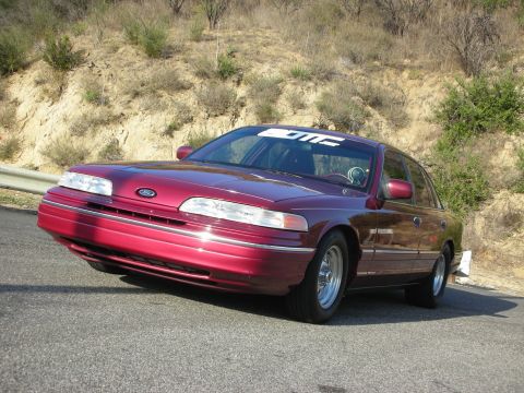 1992 Ford Crown Victoria - This 1992 Ford Crown Victoria features a lowered stance, likely due to aftermarket suspension modifications.
