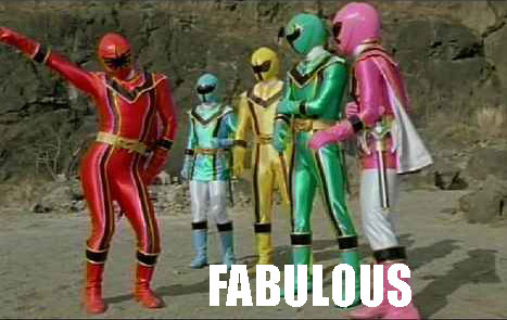 1994 Ford Bronco - A group of five individuals in brightly colored superhero costumes stand in a rocky outdoor setting.