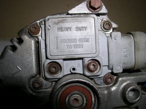 1996 Ford Probe - This is a close-up view of an automotive electrical component with instructions for testing.