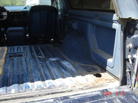 1988 Ford Bronco - Interior view of a 1988 Ford Bronco, highlighting the cargo space and seating.