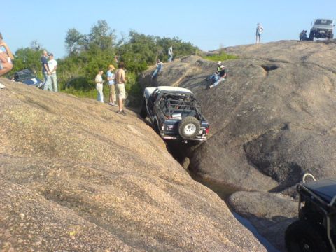 1986 Ford Bronco - Off-road vehicles tackle challenging terrain at Katemcy Rocks.