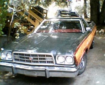 1973 Ford Ranchero - 1973 Ford Ranchero Squire showing its distinctive grille and woodgrain paneling.