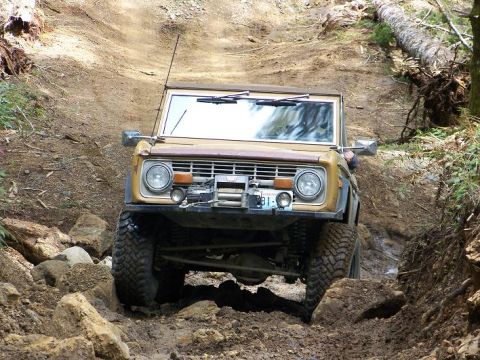 1968 Ford Bronco - This 1968 Ford Bronco navigates a challenging off-road course with steep inclines and large rocks.