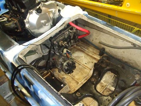 1995 Ford Mustang - Close-up view of the engine compartment of a jet ski, showing the starter motor and wiring.