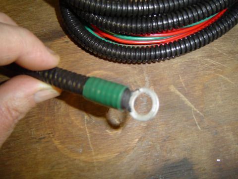1989 Ford Bronco - Close-up of a wiring harness with a ring terminal, suggesting a part related to an electrical installation.