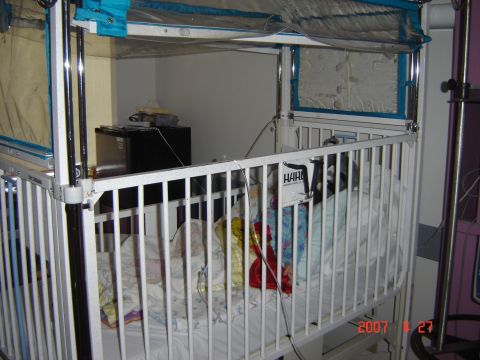 1993 Ford Bronco - Medical crib setup with bedding and visible equipment. Text 'HAR' is present on a label.