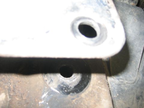 2001 Jeep Wrangler - A close-up view of a metal bracket, showing two bolt holes. The registry claims this is from a 2001 Jeep Wrangler, but the image does not p…