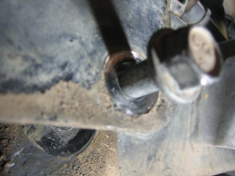 2001 Jeep Wrangler - A close-up view of a bolt and bracket, likely part of a vehicle's suspension system.