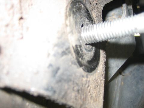 2001 Jeep Wrangler - Bolt and grommet detail, likely from a vehicle's chassis or suspension system.