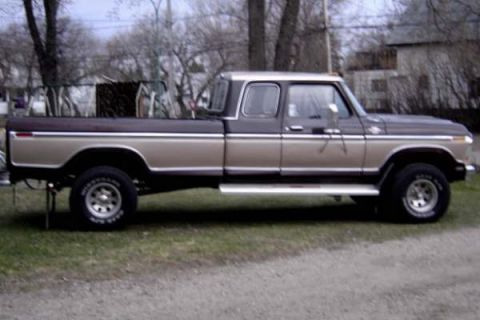 1979 Ford Bronco - This Ford F-Series pickup truck features a two-tone paint scheme and a crew cab configuration.