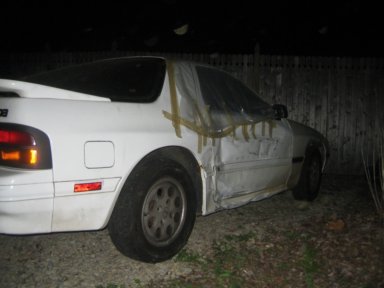 1991 Mazda RX-7 - This 1991 Mazda RX-7 shows extensive damage to its body panels.