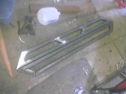 1989 Ford Bronco - Custom metal fabrication is shown on a workshop floor, not a 1989 Ford Bronco.