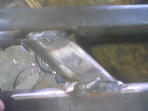 1989 Ford Bronco - Close-up view of a welded metal component, likely a custom part for a vehicle.