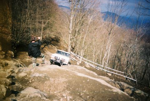 1978 Ford Bronco - This 1978 Ford Bronco is tackling a steep, rocky incline on an off-road trail.