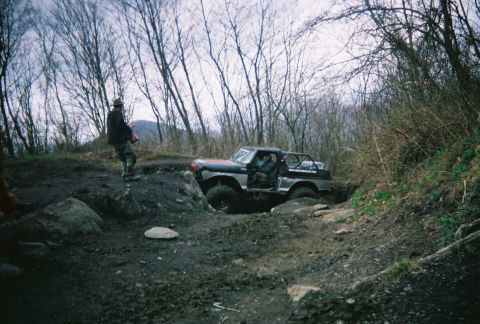 1978 Ford Bronco - This 1978 Ford Bronco tackles a challenging off-road course with steep inclines and muddy terrain.